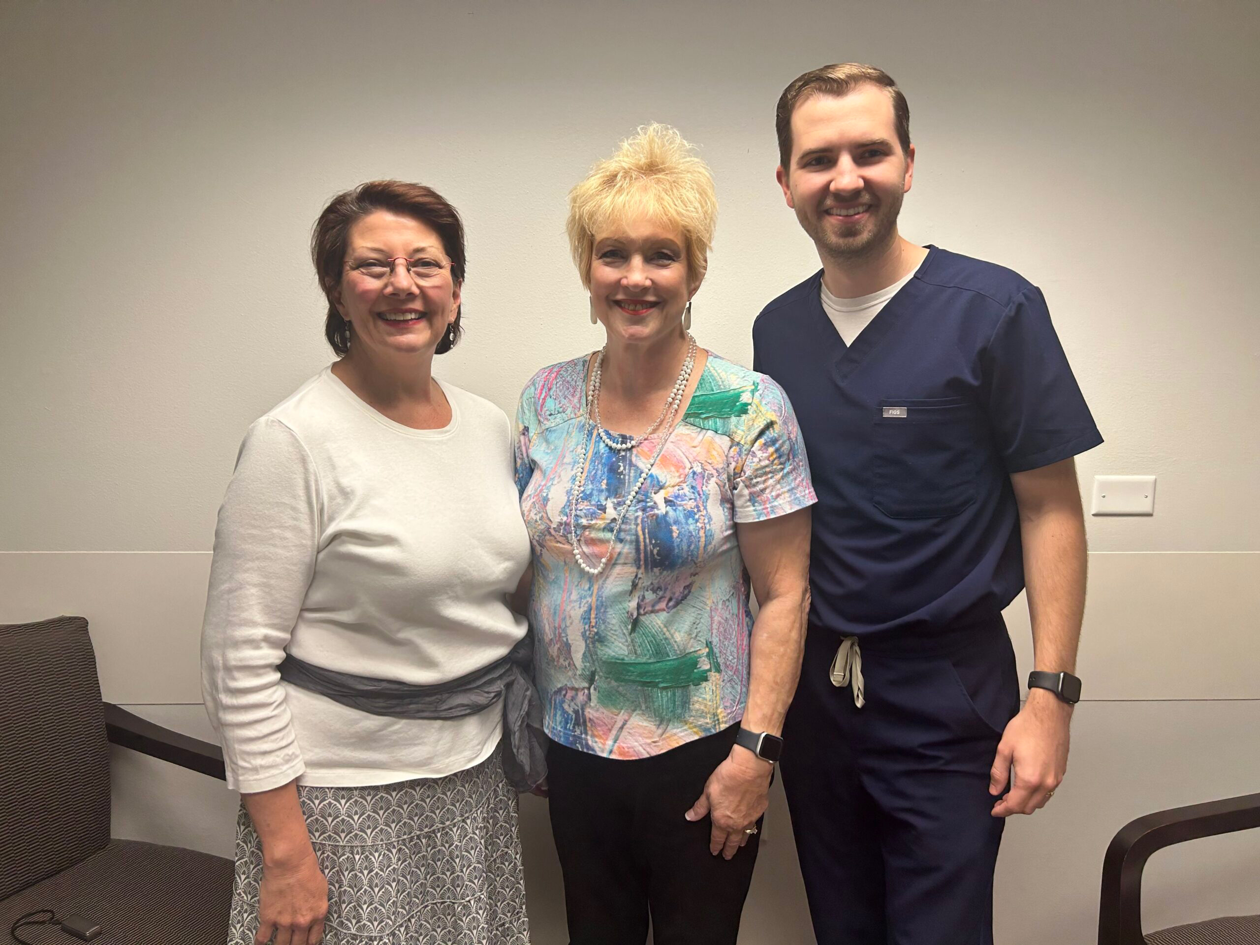 Nina Cox between Jessica Copeland as her health coach and Dr. Jacob Rogers as her clinical pharmacist care team