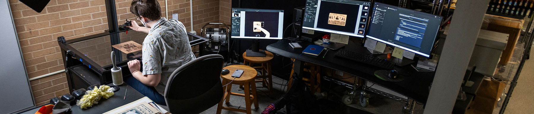 A student archivist works in the UNT Special Collections Digital Projects Lab