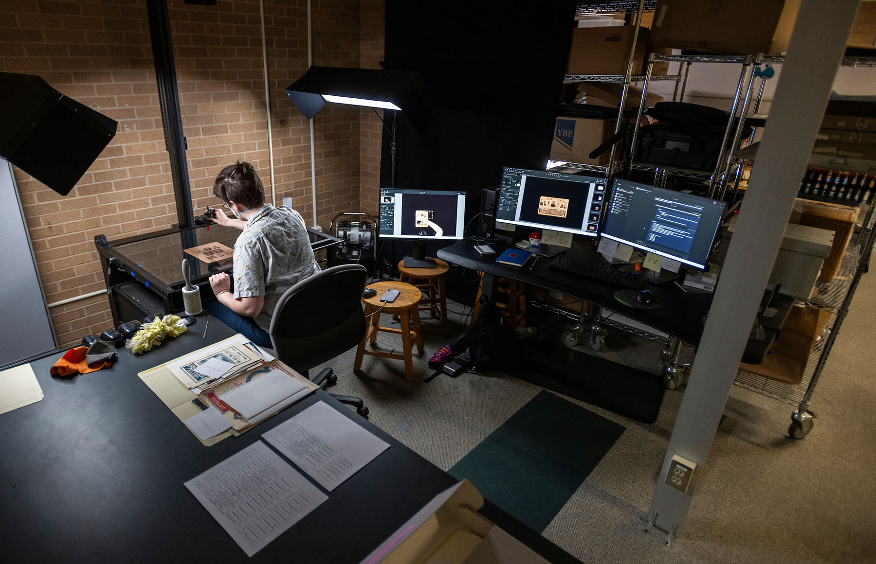 student archivist works in the UNT Special Collections Digital Projects Lab