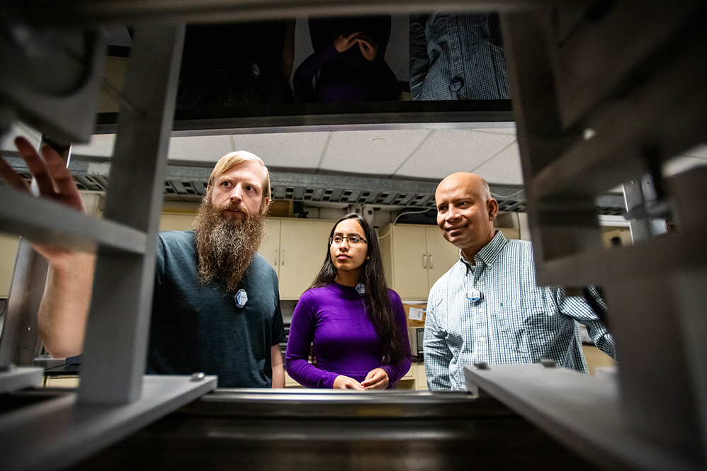 Photo of UNT researchers in the Ion Beam Laboratory.