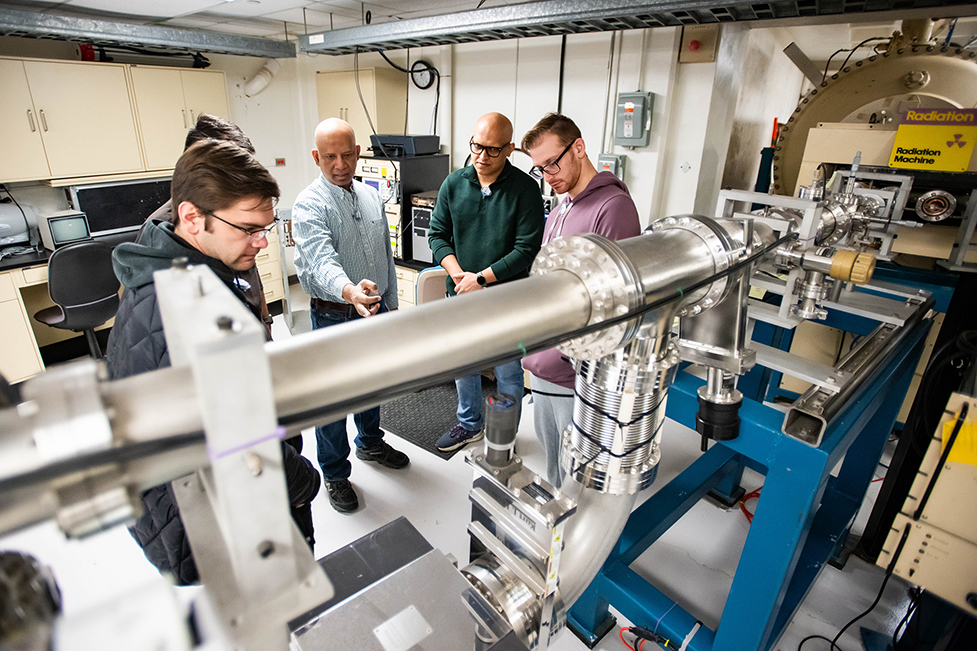 Photo of UNT researchers in the Ion Beam Laboratory.