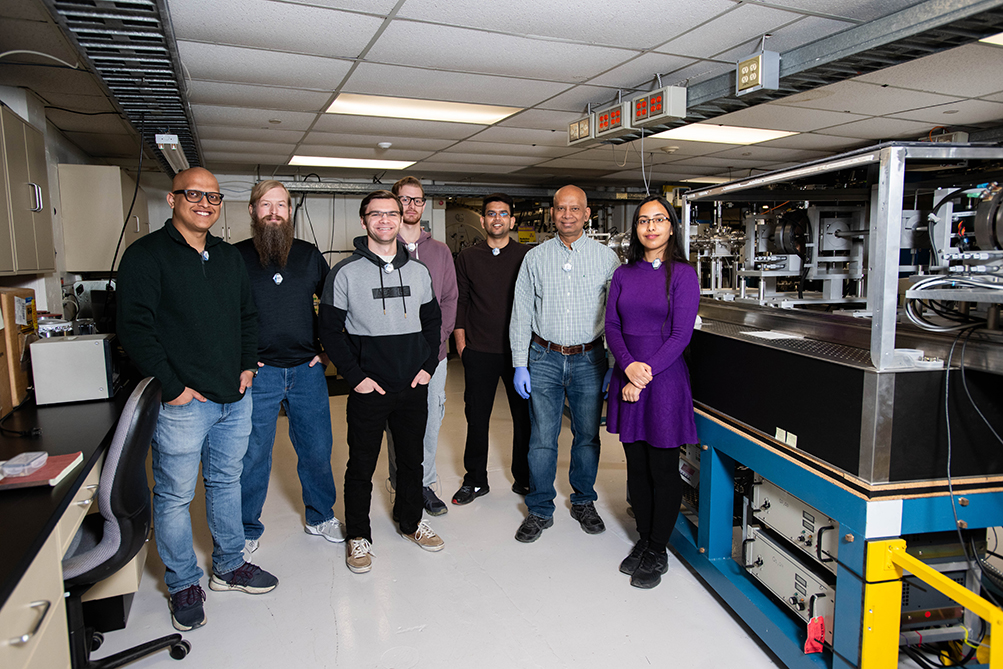 Photo of UNT physics professor Bibhudutta Rout and his student researchers.