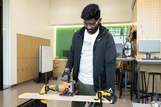 Student using power tools