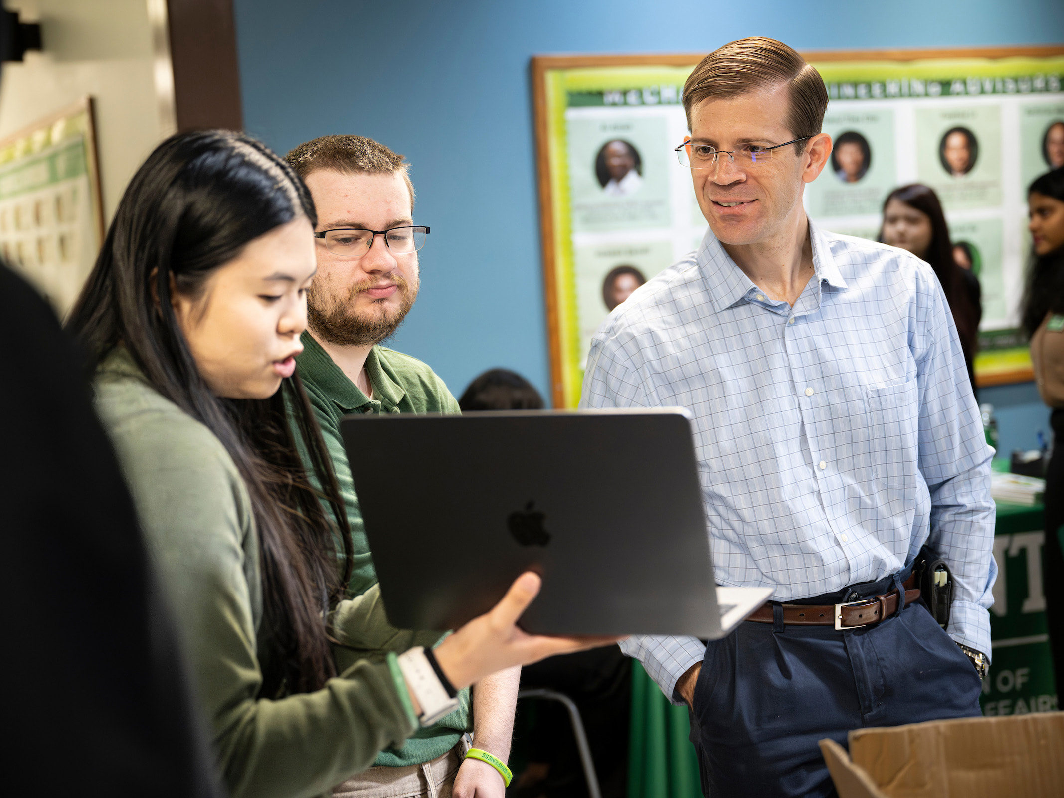 UNT College of Engineering Dean Paul Krueger Paul Krueger with students during Senior Design Day