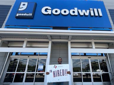 A UNT WISE TBE participant celebrates his job placement at a Goodwill in Dallas. 