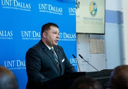 UNT Dallas's Dustin Schellenger addresses the media and university community at the TLEPN launch announcement in 2023 