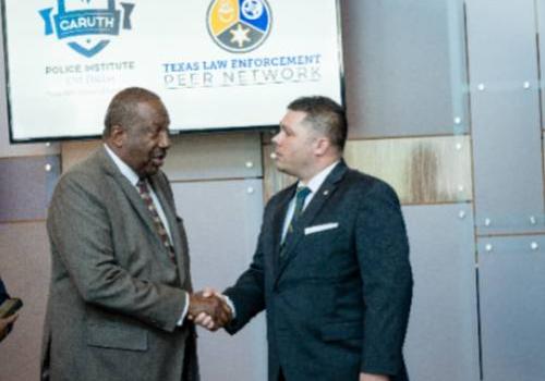 State Sen. Royce West congratulates UNT Dallas's Dustin Schellenger at the press conference about TLEPN 