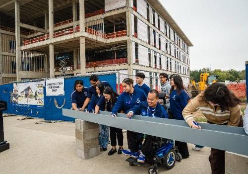 UNT Dallas students Sign a Steel Beam at the Topping Off Ceremony