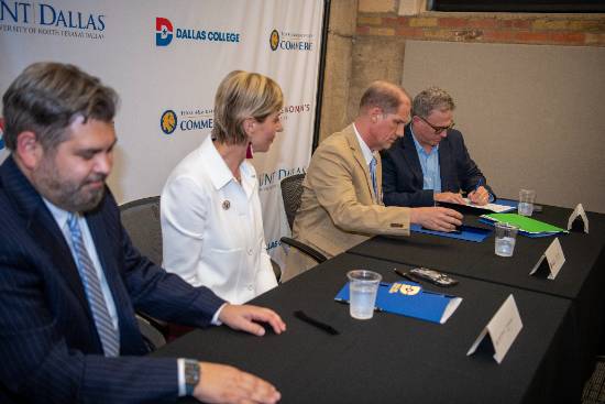 UNT Dallas President Warren von Eschenbach signs the Dallas Transfer Collaborative Agreement as leaders from Dallas College, Texas Women's University and Texas A&M Commerce look on