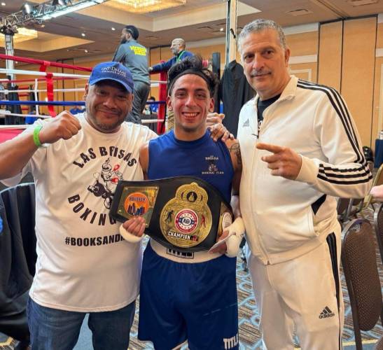 Noe Mendoza Holding a Champion Belt After Winning a National Boxing Tournament 