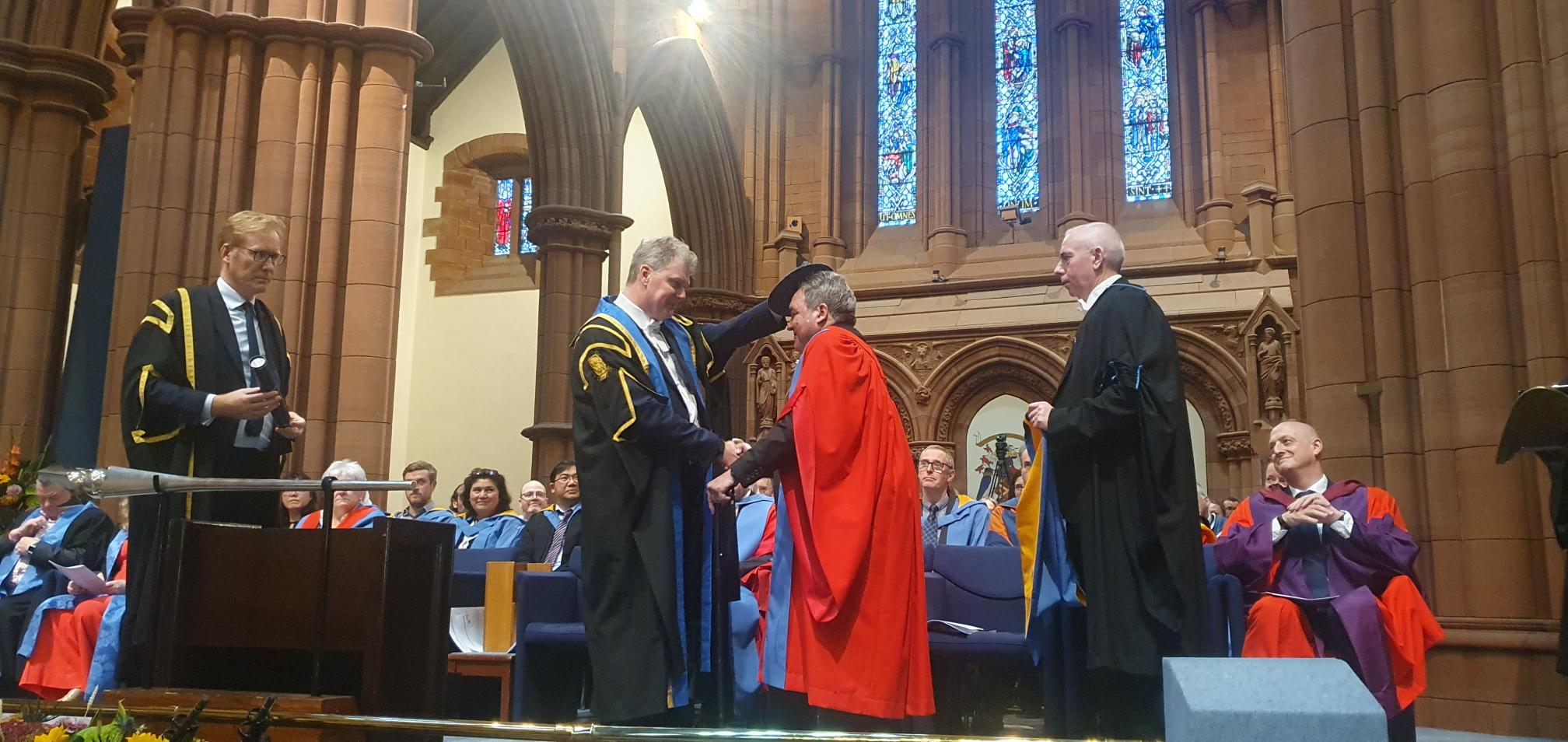 Dr. Albert Yurvati being awarded an honorary Doctor of Science degree